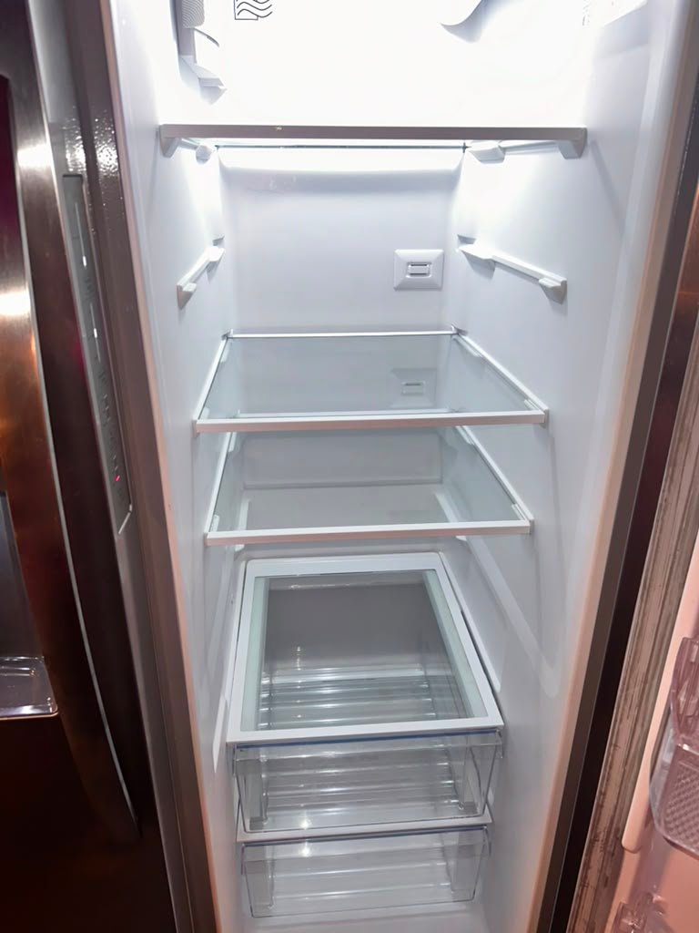 Spotless, sanitized refrigerator interior cleaned by Katherine's Cleaning Services